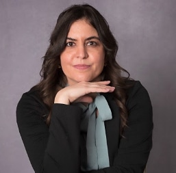 Eydis Lima, Project Engineering Lead at C3 Medical, posing thoughtfully with hand under chin, representing innovation in medical device consulting.